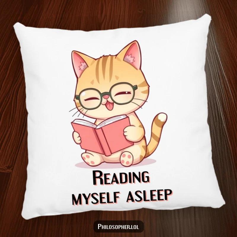 Funny giggling cat spectacles pillow, a cat with glasses laughing while engrossed in a very small book.