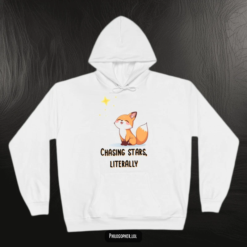Funny hoodie featuring a joyful fox gazing upwards at a distant, twinkling star.
