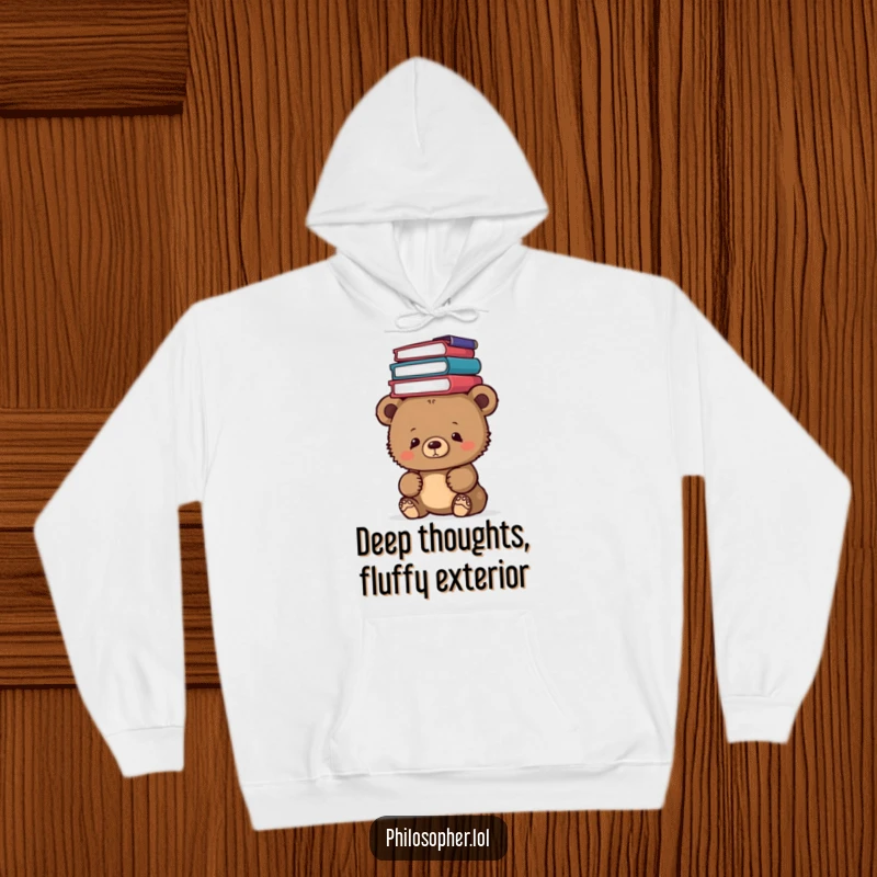 Funny bear cub wearing a hoodie, balancing philosophy books on its head, looking thoughtful, a cozy and intellectual design.