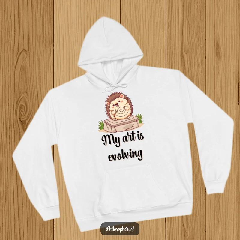 Funny hedgehog hoodie, wobbling hedgehog drawing a spiral on a stone tablet, cozy art apparel, cute pet design.