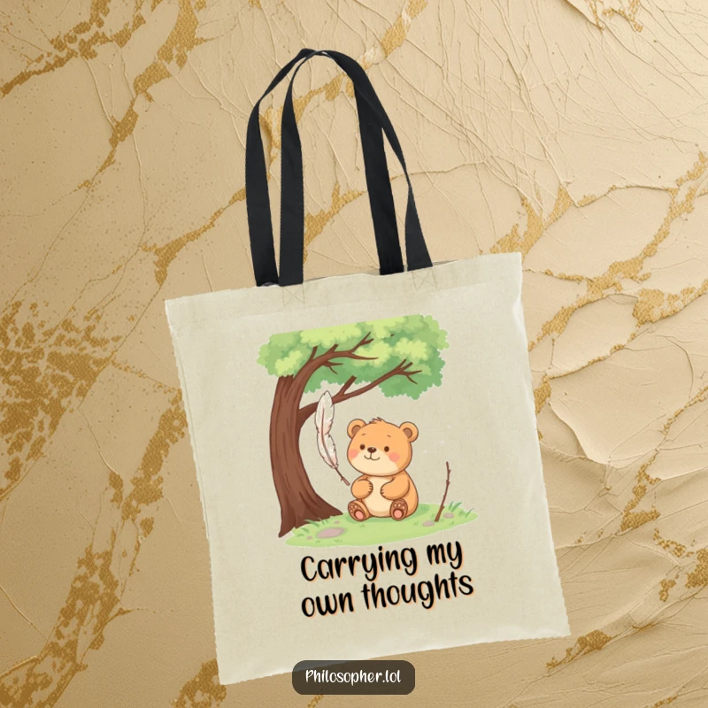 Funny happy bear sits under a tree, pondering a floating feather on a tote bag, carrying peaceful thoughts.